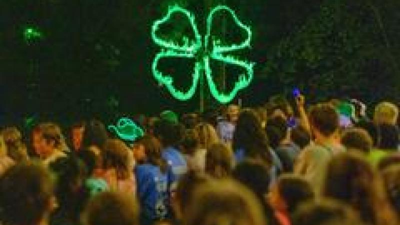 4-H Camp group with a green flaming clover